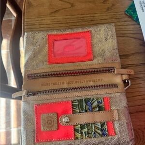 Wristlet or crossbody style consuela purse.
